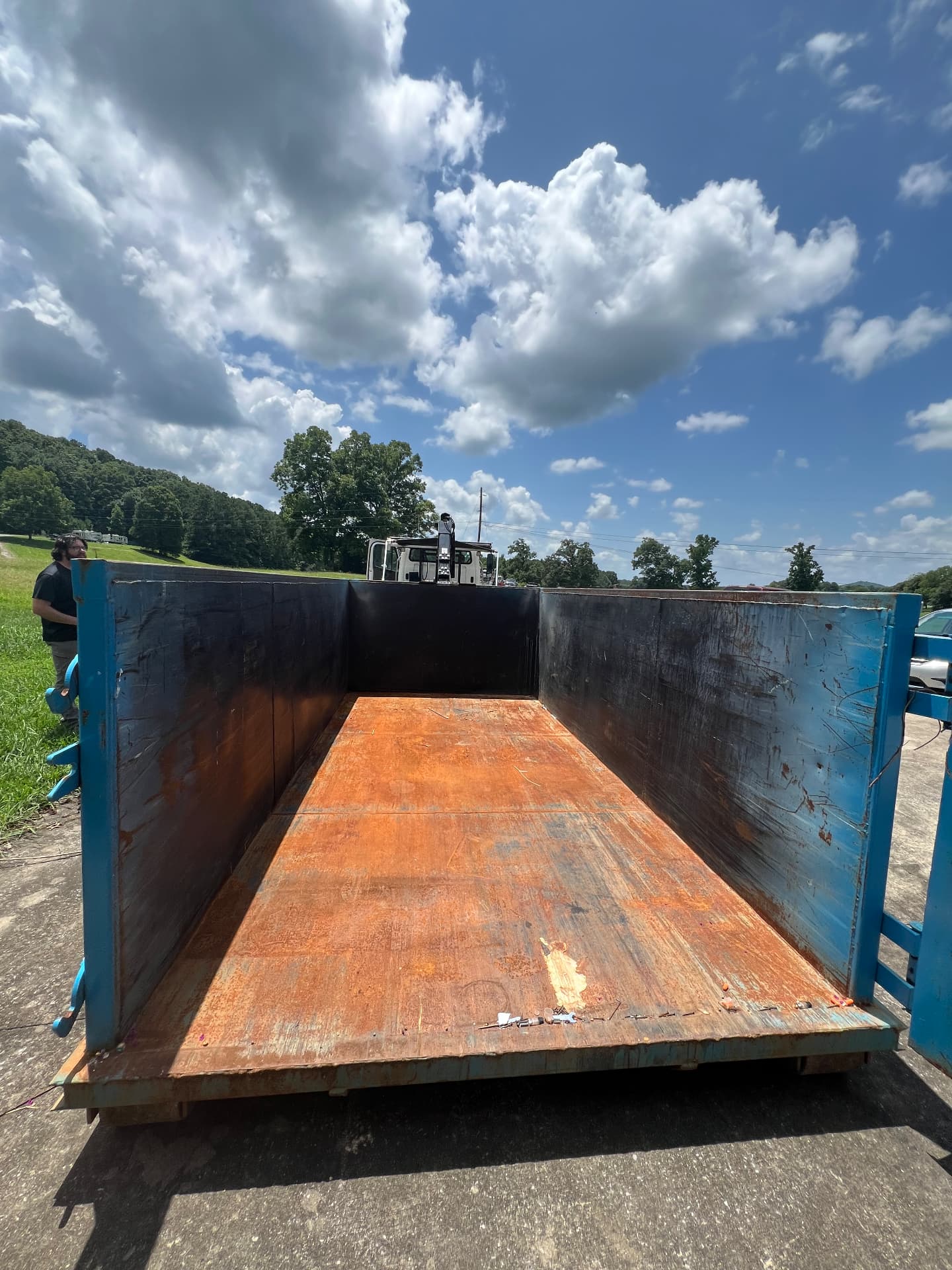 Inside view of a clean, empty roll off dumpster ready for loading